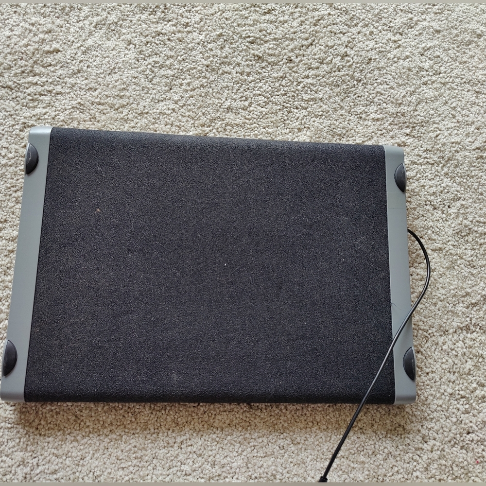 Black and Gray Laptop Cooling Pad Designed To Prevent Laptops From Overheating.